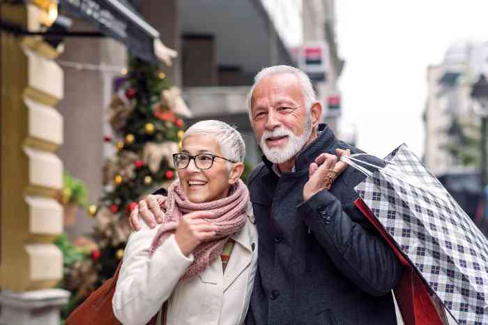 Older couple shopping outdoors during the holidays