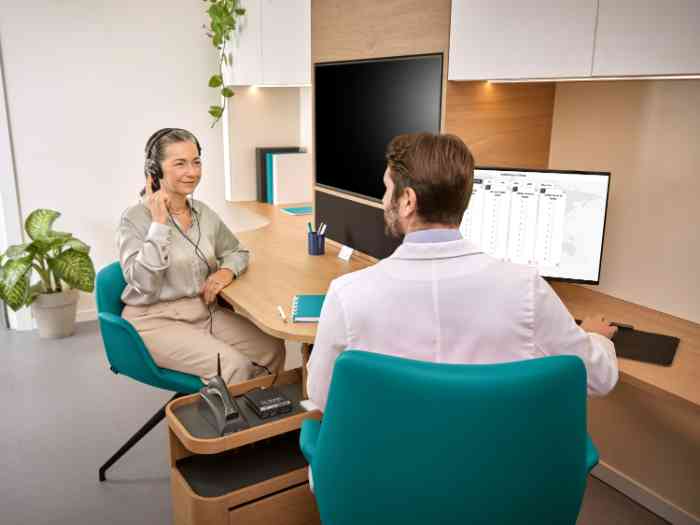 Woman smiling during the hearing test